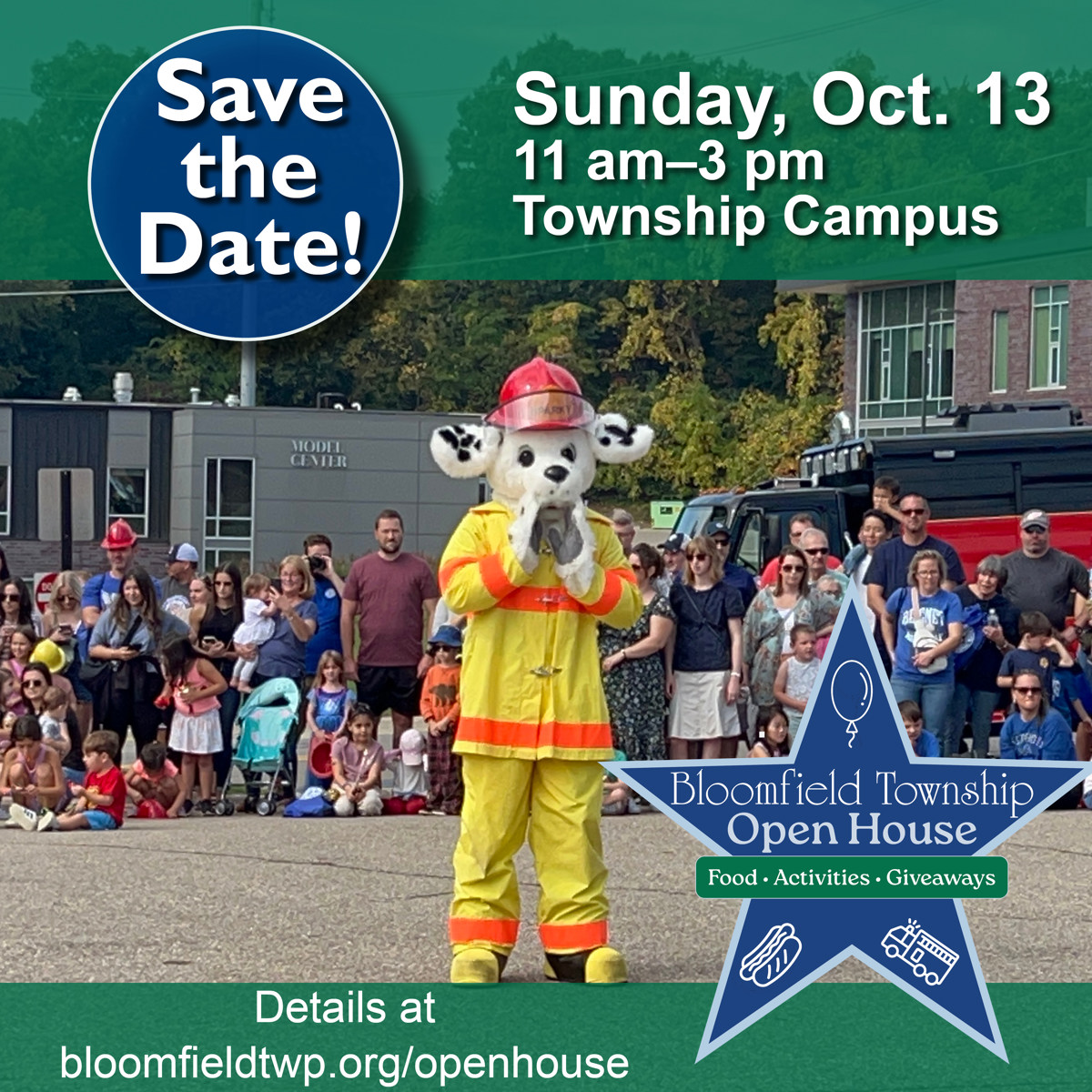 A group of people and children gathered behind a costumed dog in a firefighting uniform. 