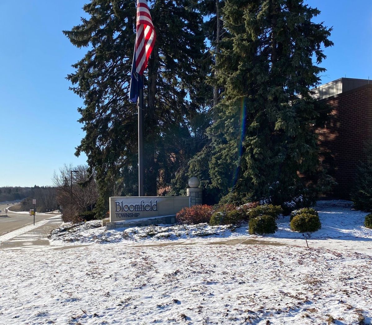 Bloomfield Township sign with snow surrounding it. 