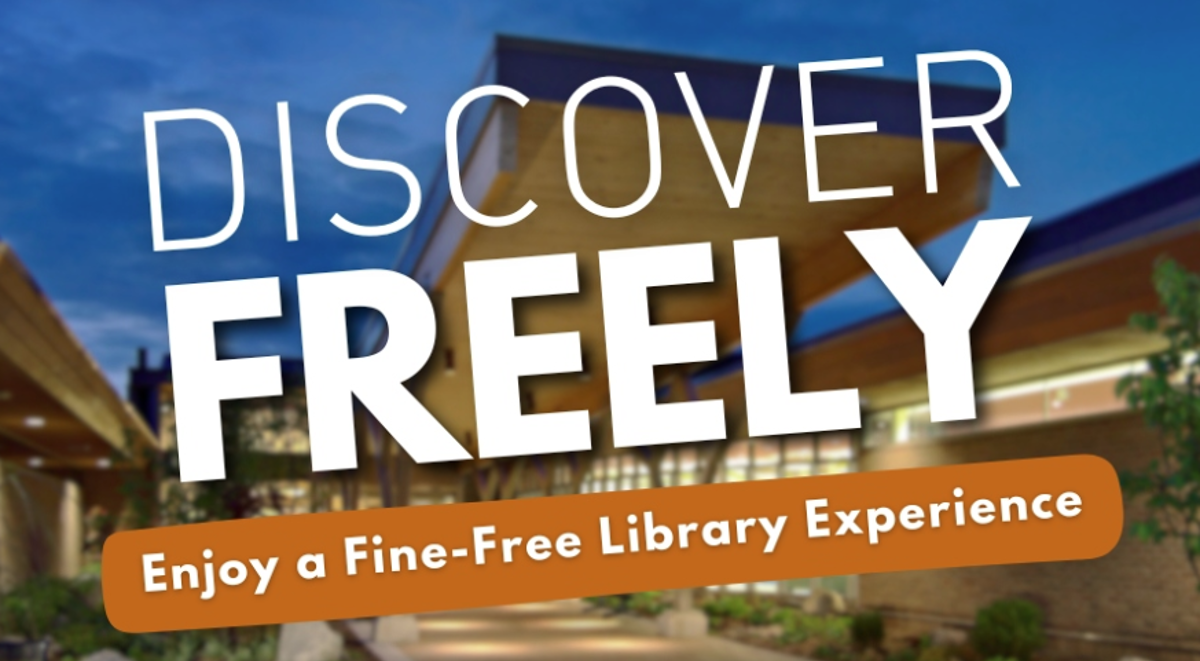 The words "discover freely enjoy a fine-free library experience" in front of a building. 
