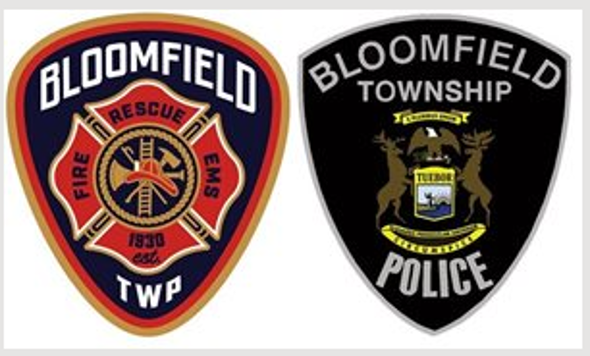 The Bloomfield Township Fire Department badge next to the Bloomfield Township Police Department badge. 