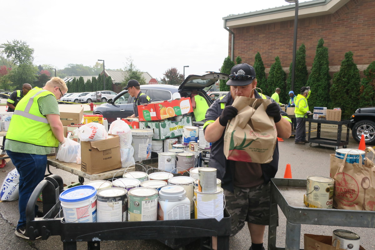 Men handling hazardous waste for the day event. 