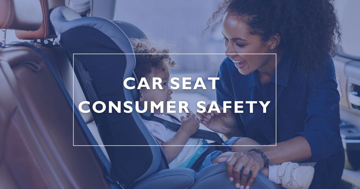 A mother buckling her child in a car seat for car seat consumer safety. 