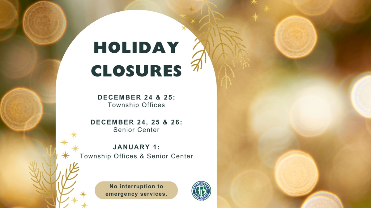 Gold lights reflecting behind a notice that reads: Holiday Closures December 24 & 25 Township Offices, December 24, 25 & 26 Senior Center, January 1 Township Office and Senior Center. No interruption to emergency services.