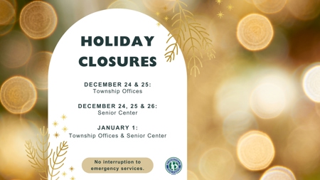 Gold lights reflecting behind a notice that reads: Holiday Closures December 24 & 25 Township Offices, December 24, 25 & 26 Senior Center, January 1 Township Office and Senior Center. No interruption to emergency services.
