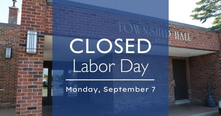 Entrance to Township Hall with notice that reads: Closed Labor Day Monday, September 7. Emergency services will remain in effect.