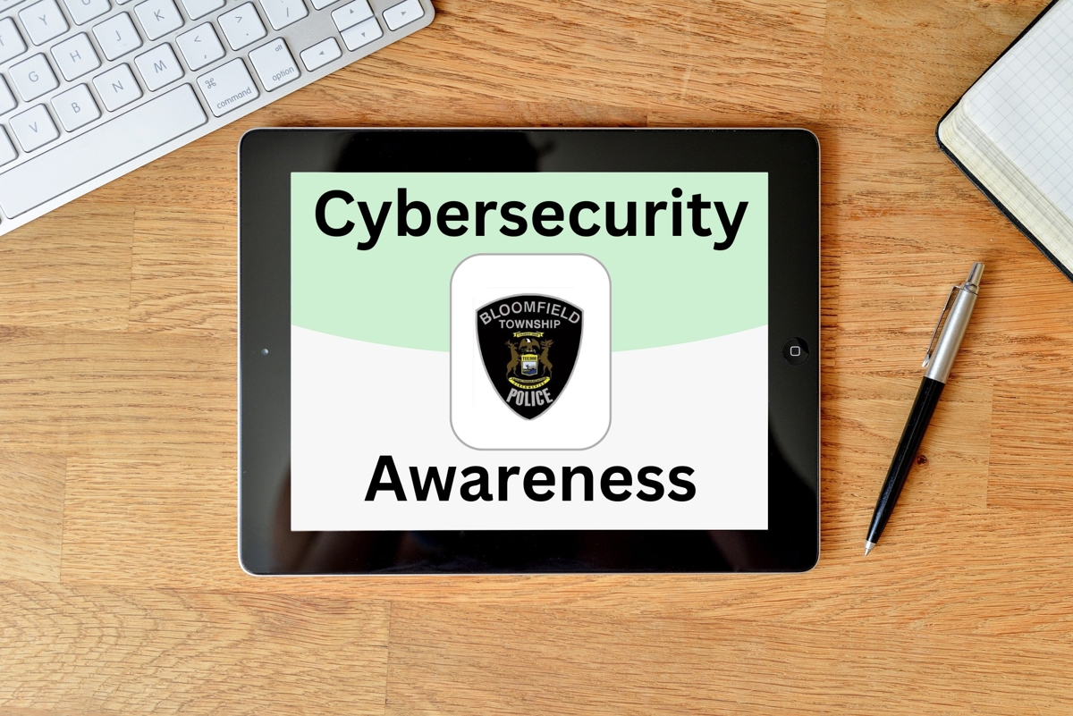 A tablet with the Bloomfield Township Police Department logo and cybersecurity awareness on it. 